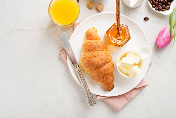 Delicious breakfast with fresh croissants. - Photo, Image