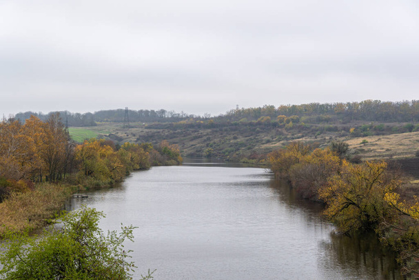 Autumn landscape overlooking the river. Autumn nature top view. Autumn landscape - 写真・画像