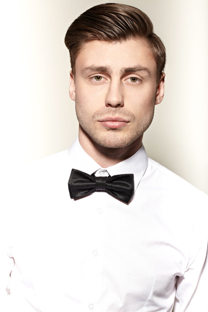Man in white shirt and bow tie - Fotoğraf, Görsel