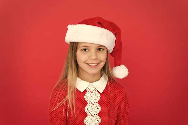 Christmas shopping. New year party. Santa claus girl. Happy winter holidays. Present for xmas. Carefree childhood. Little girl child in santa red hat. Believe in Santa Claus. Childhood memories - Fotó, kép