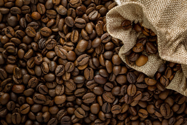 A top view of the fresh and roasted coffee beans - Фото, зображення