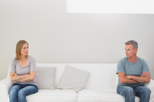 Unhappy couple not talking after an argument at home - Fotó, kép