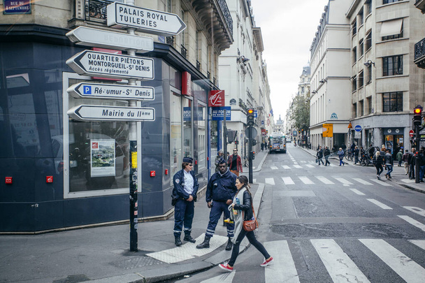 PARIS, FRANCE - October 7, 2016: Citizens walk past a streets,  cafeterias  and stores  on October 7, 2016  in Paris.  Paris street life in daytime - 写真・画像