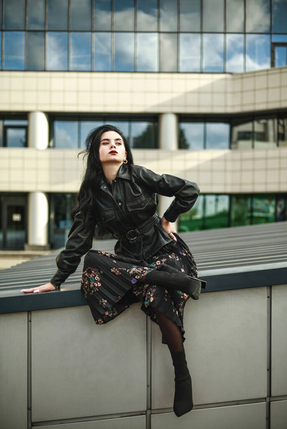 Young girl model outdoors in urban style fashionable posing - Valokuva, kuva