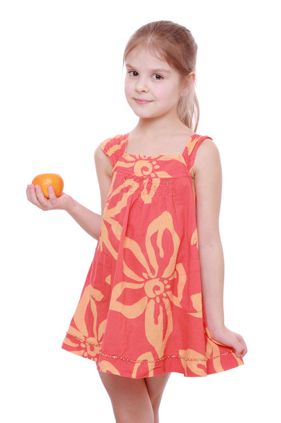Girl holding mandarin - Photo, Image