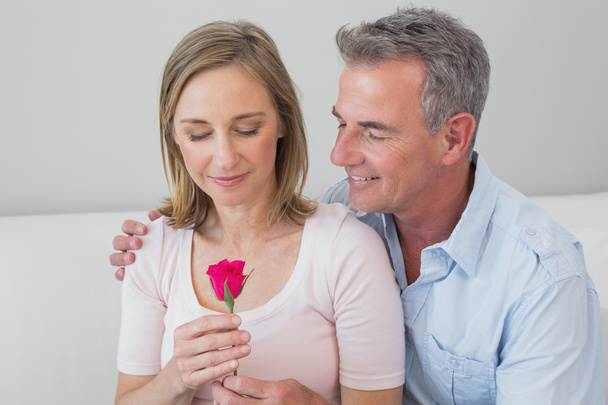 Happy romantic couple with a flower - Photo, image