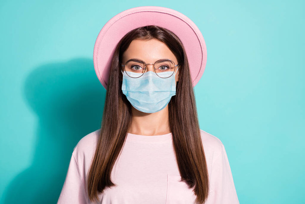 Photo of optimistic nice lady woman wear safety mask casual pink outfit isolated teal color background - Foto, imagen