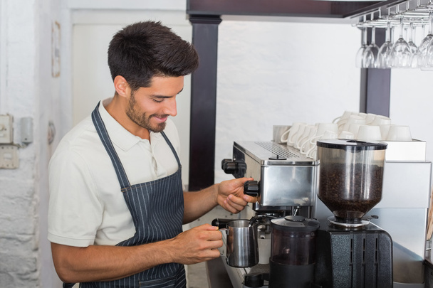 Waiter making cup of coffee at coffee shop - Photo, image