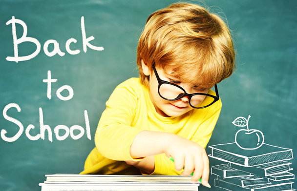 Talented child. Blackboard background. First school day. Kids school. Hard exam. Cheerful smiling child at the blackboard. - Photo, Image