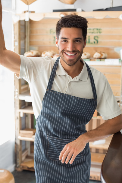 Portrait of a smiling young male barista at coffee shop - Foto, Imagen