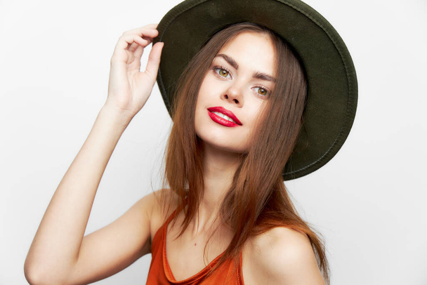 Woman in a hat Charming smile looking ahead evening makeup  - Foto, Imagen