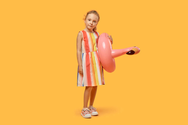 Summer girl in a dress with a swimming circle. - Фото, зображення