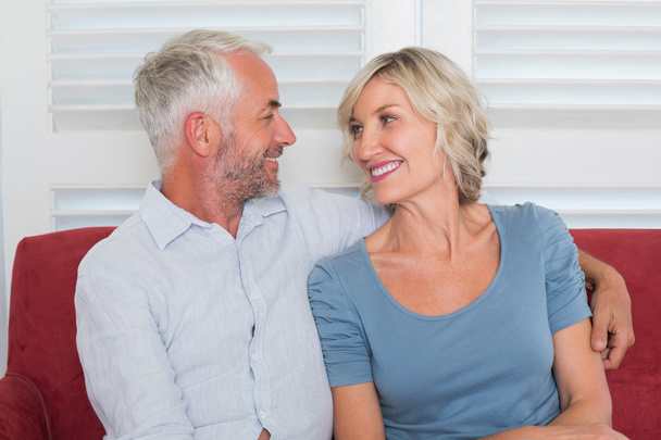 Relaxed mature couple sitting on couch - Photo, Image