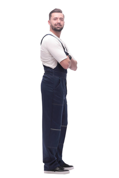 side view. smiling man in overalls looking forward to copy space - Photo, image