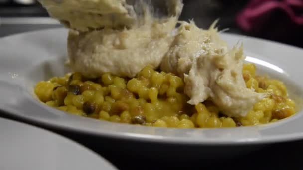 Fregola with cod cream. - Footage, Video