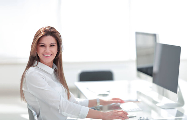 smiling business woman in the workplace. - Photo, Image