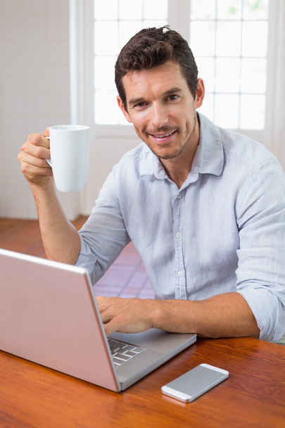 Portrait of a smiling man with coffee cup - Φωτογραφία, εικόνα