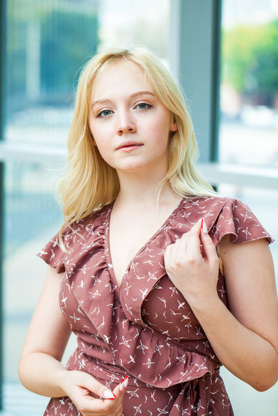 Close up portrait of a young beautiful blonde woman in summer dress - Fotoğraf, Görsel