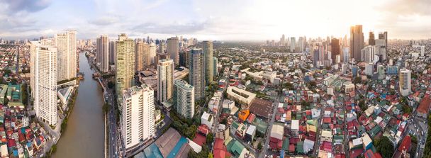 Makati, Metro Manila, Philippines - Afternoon Wide aerial panorama of Makati Skyline from the Pasig River. The clusters of Rockwell Center, Ayala CBD and the hotels and condos of Poblacion. - Photo, Image