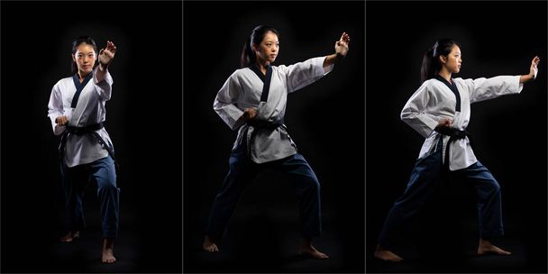 Master Black Belt TaeKwonDo Karate dziewczyna, która jest sportowcem narodowym młody nastolatek pokaż tradycyjne walki pozy kick punch w stroju mundurowym sportu, czarne tło izolowane, rozmycie ruchu na rękach stóp - Zdjęcie, obraz