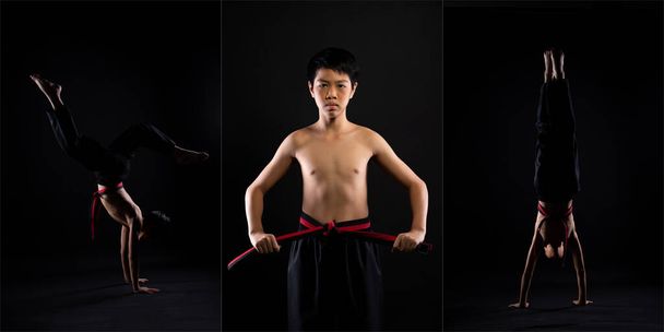 Master Red Black Belt TaeKwonDo Karate ragazzo che è atleta giovane adolescente spettacolo tradizionale Combattere pose in abito sportivo, sfondo nero isolato, bassa esposizione scura - Foto, immagini