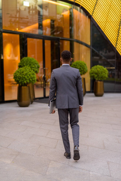 Full length rear view shot of businessman walking - Фото, зображення