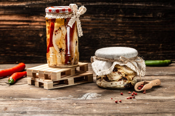 Assortment of cheese. Soft, hard, cheese balls. Ecology and eco-products, Jar with cheese marinated in oil, - Fotografie, Obrázek
