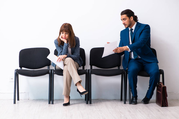 Young businessman and businesswoman waiting for an interview at - Photo, Image