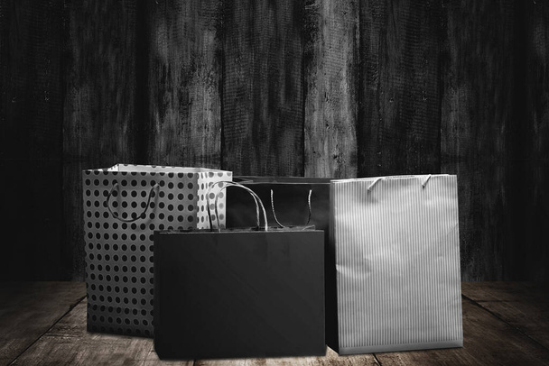Shopping bag with a wooden background. Black Friday concept - Foto, Bild