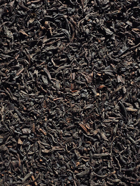 Dried black tea leaves background - Photo, Image