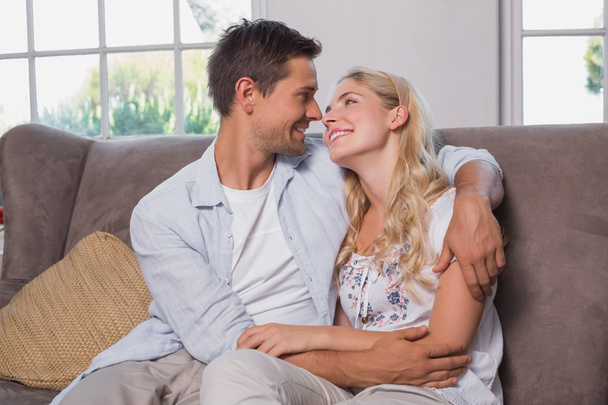 Relaxed loving couple sitting on sofa - Foto, immagini