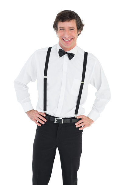 Smiling groom wearing suspenders - Fotó, kép