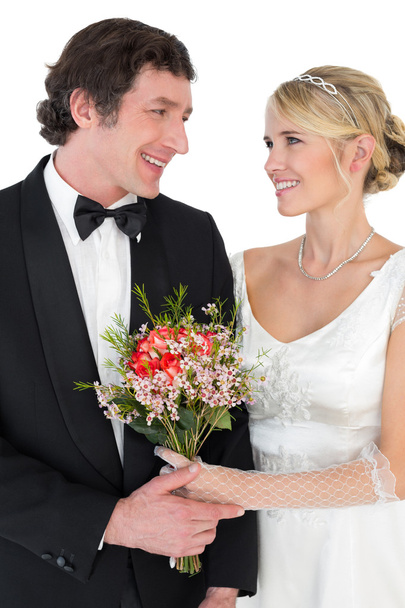 Bride and groom with flower over white background - Fotoğraf, Görsel