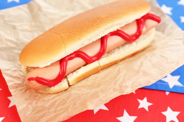 Tasty hot dog on napkin with stars - Zdjęcie, obraz