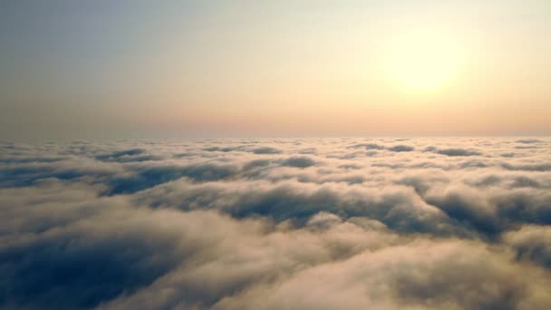 sunset over the clouds. Flying over the clouds at sunset. - Footage, Video