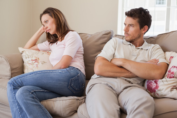 Couple not talking after an argument in living room - Foto, imagen