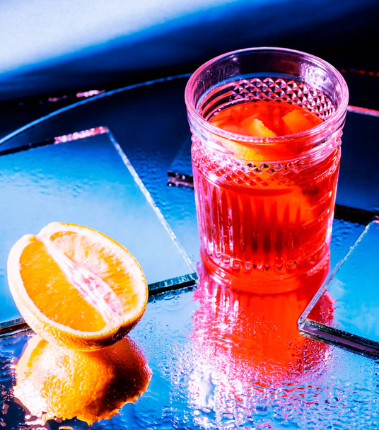 A glass of tea and lemon on a glass table. - Fotoğraf, Görsel
