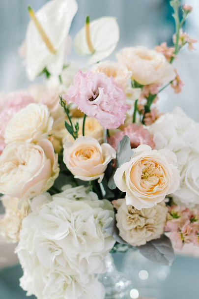 Wedding flowers, bridal decor closeup. Decoration made of peonies, roses and decorative plants - 写真・画像