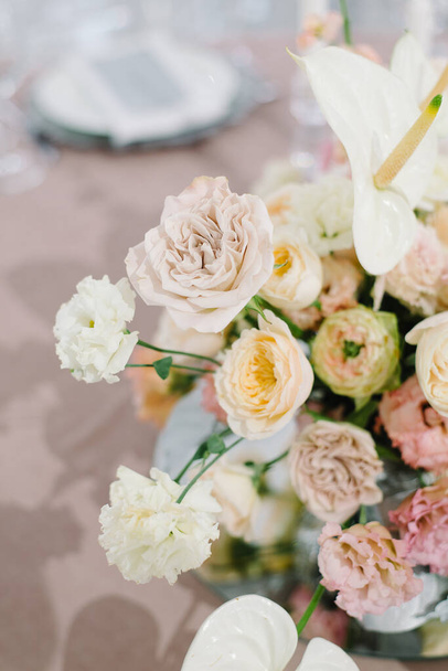 Wedding flowers, bridal decor closeup. Decoration made of peonies, roses and decorative plants - Фото, изображение