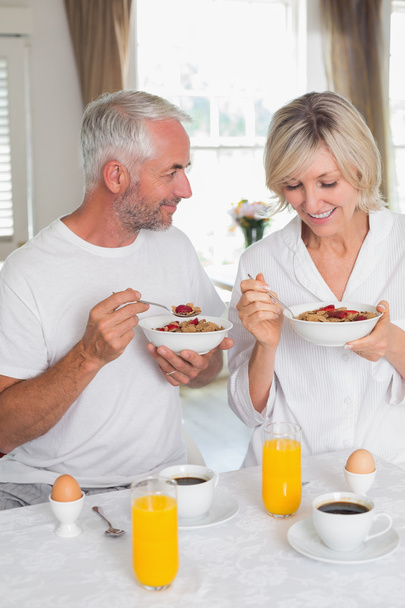 Happy mature couple having breakfast - Photo, Image