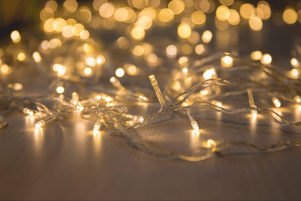 Christmas lights on dark background with copy space. Decorative garland - Foto, Imagem
