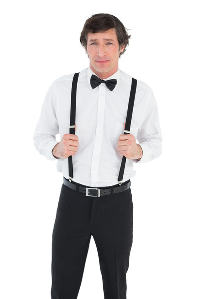 Confident groom holding suspenders - Foto, Imagem