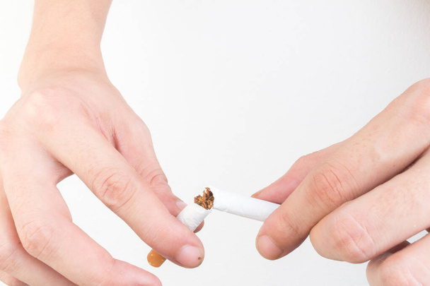hand hold cigarette destroy isolated on white background. - Photo, Image