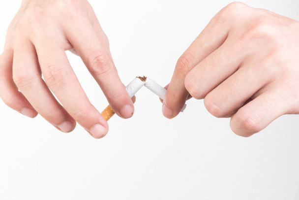 hand hold cigarette destroy isolated on white background. - Photo, Image