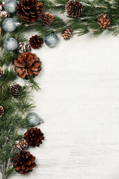 Happy New Year 2020 greeting card. Christmas branches on rustic wooden background. Space for text. Top view - Photo, Image