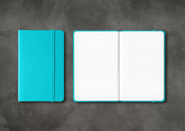 Aqua blue closed and open lined notebooks mockup isolated on dark concrete background - Foto, afbeelding