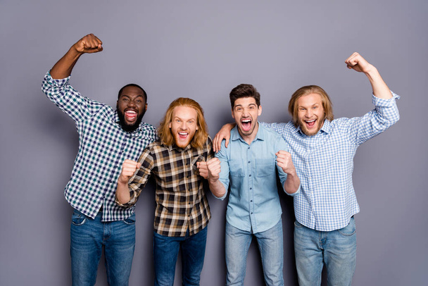 Portrait of four nice attractive glad ecstatic overjoyed cheerful cheery guys celebrating great attainment cup championship isolated over gray purple pastel color background - Фото, зображення