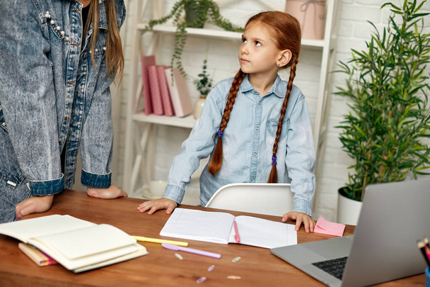 little child girl using laptop for studying online - Foto, imagen