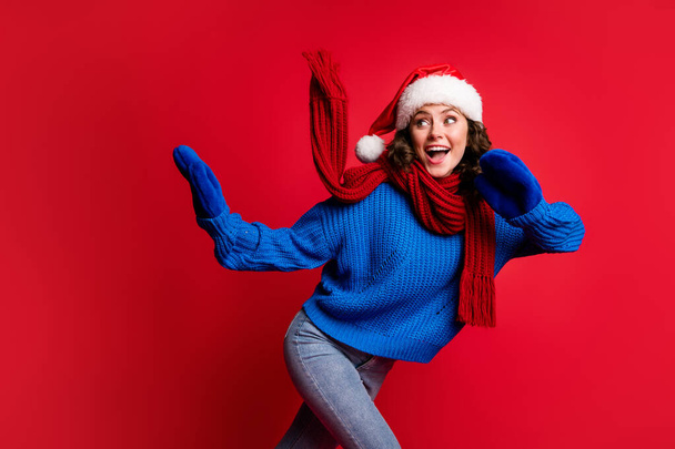 Portrait of her she nice attractive pretty lovely glad cheerful cheery girl wearing Santa look outfit having fun skiing pastime free spare time isolated bright vivid shine vibrant red color background - Zdjęcie, obraz