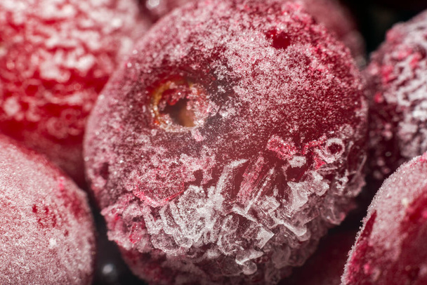 Ripe juicy frozen cherries closeup background texture. - Foto, afbeelding